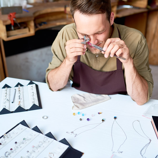 appraiser inspecting jewelry
